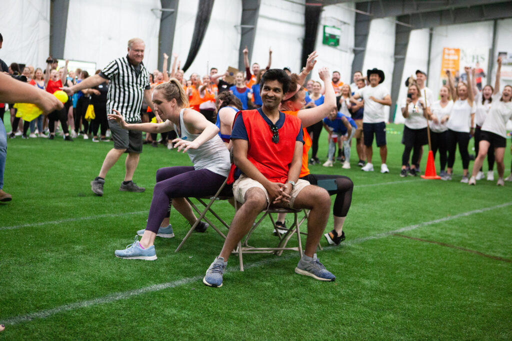 Team members playing game on turf