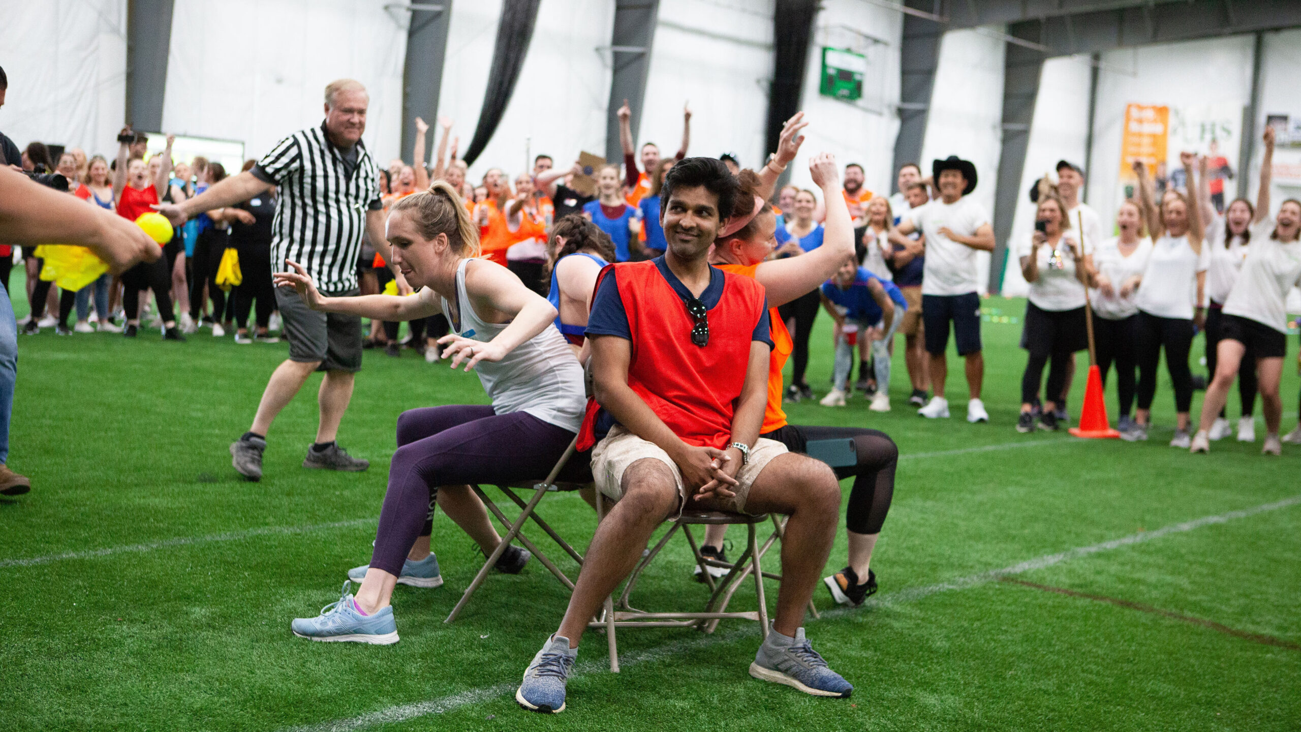 Team members playing game on turf